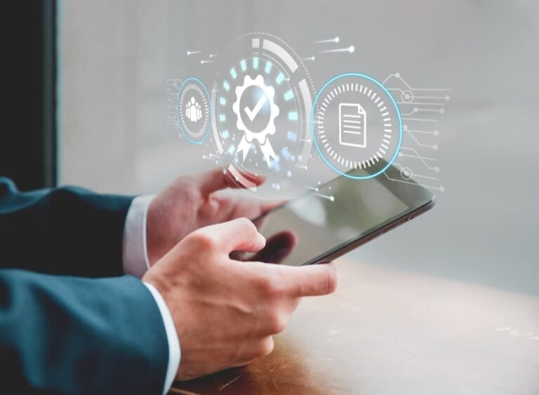 Male hands holding a tablet. Graphic elements representing a Quality System.